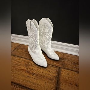 Women’s white leather cowboy boots.